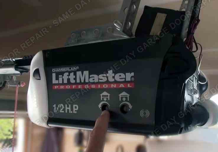 Person adjusting garage door opener settings in Walnut Creek, CA